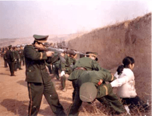 Shortly after this picture was taken, the soldier put a bullet through the head of this teenage girl. Her crime? Telling others about Jesus in public during the Bejing Olympics.